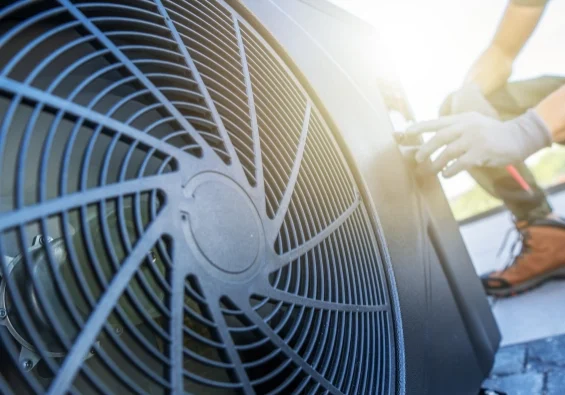 Commercial HVAC technician performing rooftop unit service for an Ohio business facility